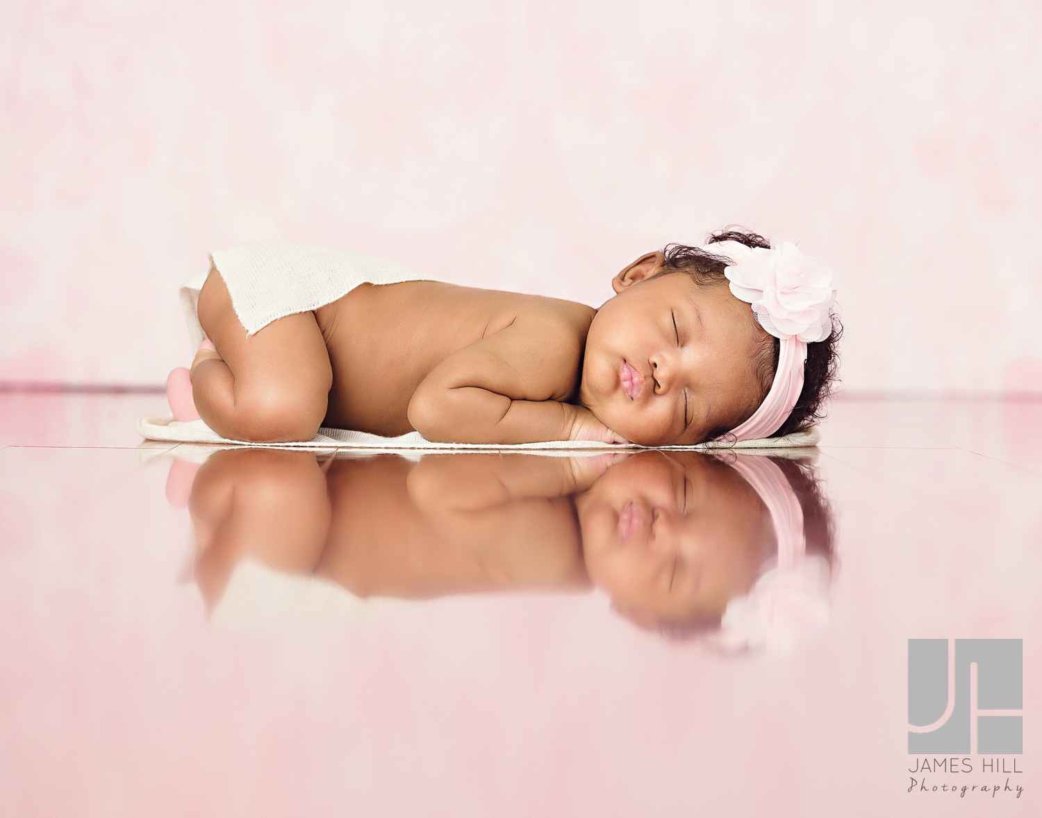 newborn baby pink background