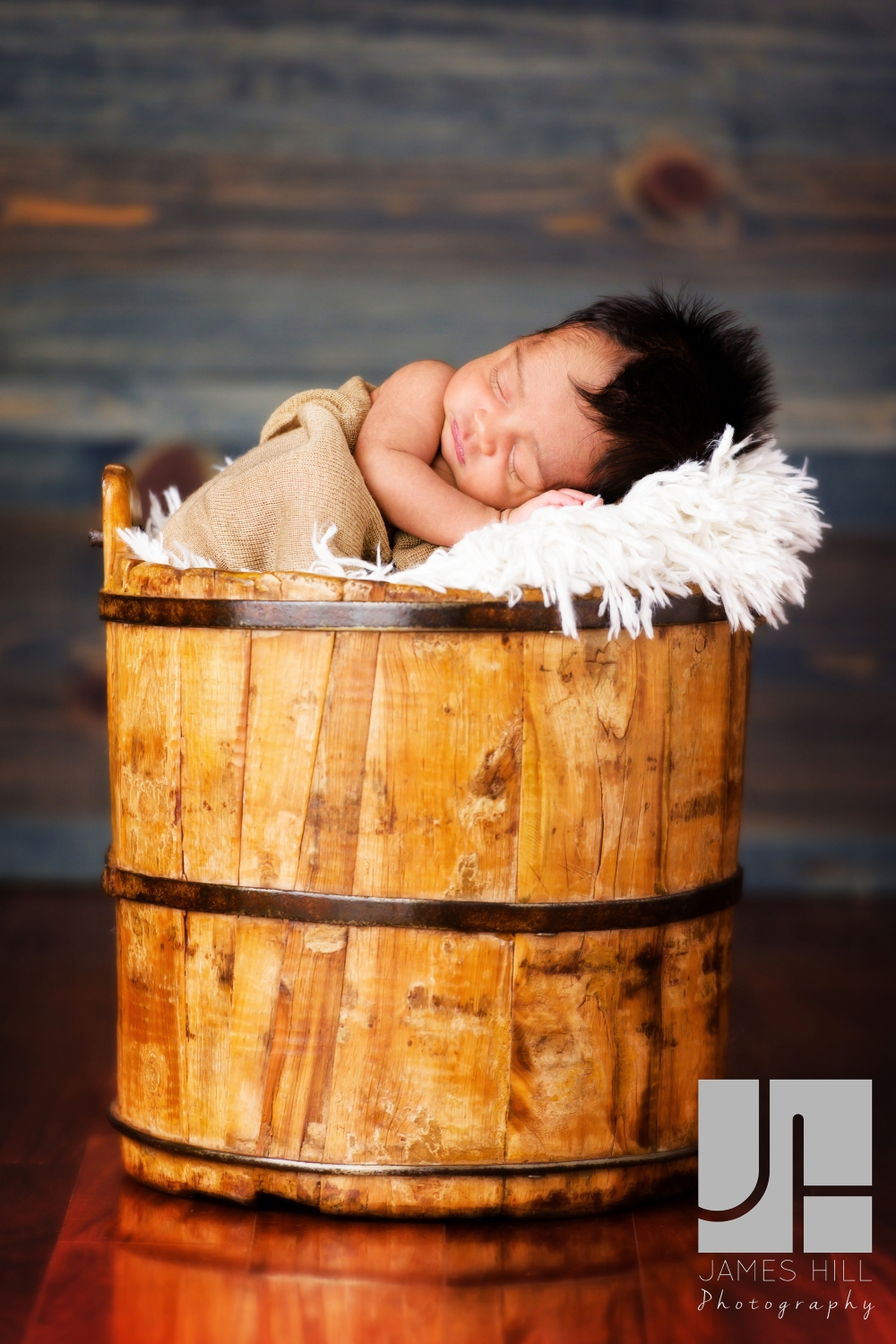 newborn baby in a bucket