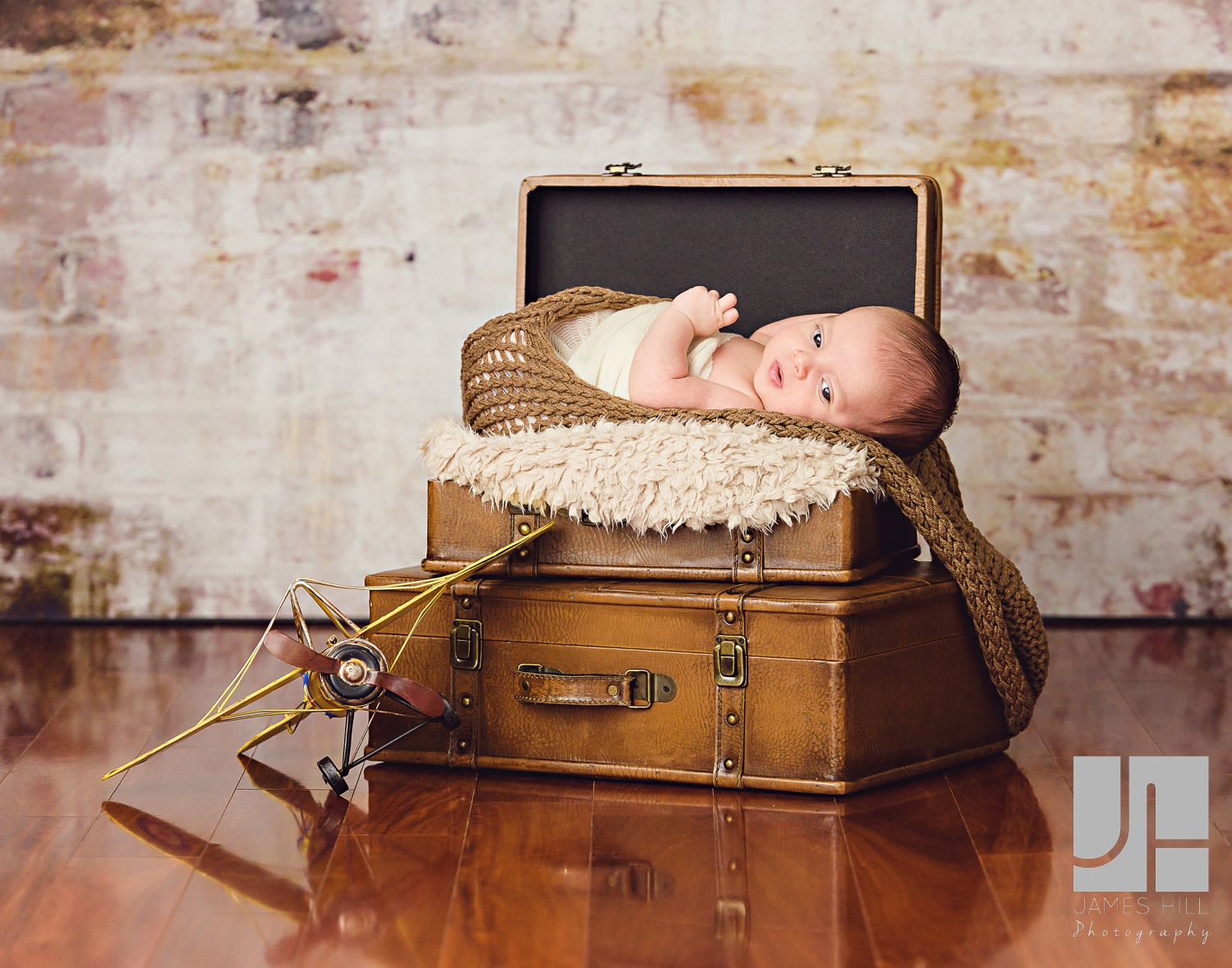 newborn baby in a suitcase