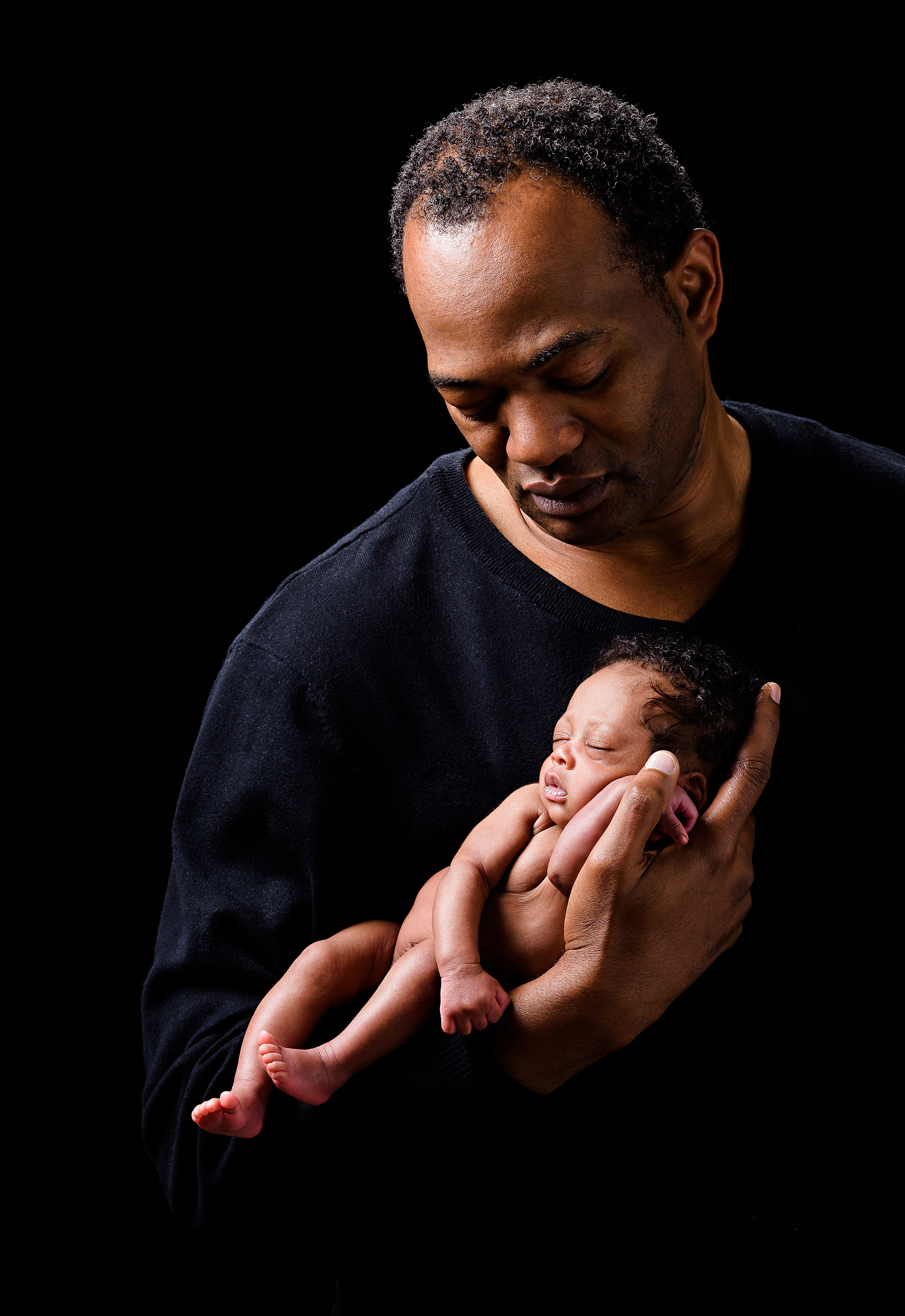 Beautiful portrait with dad and his newborn