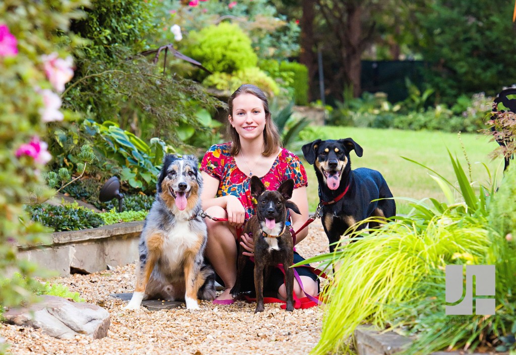 Mom poses with puppies